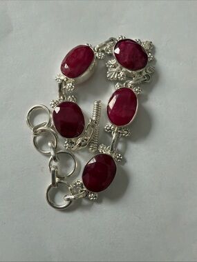 Sterling Silver Bracelet with Faceted Ruby-Red Stones
